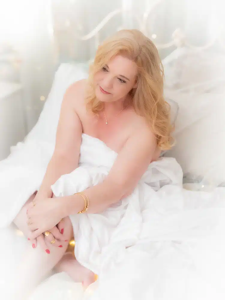 mature woman reflected in mirror for boudoir photoshoot