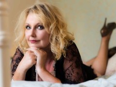 mature woman  posing on bed for a Boudoir Photograph Lincolnshire