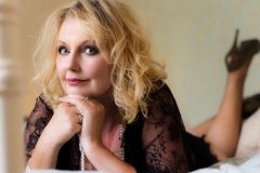 mature woman  posing on bed for a Boudoir Photograph Lincolnshire