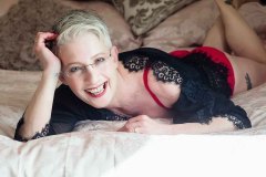 woman in black lace gown  posing for Boudoir Photograph Lincolnshire