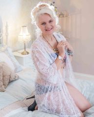 woman on bed in white lace gown Boudoir Photography Lincolnshire