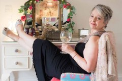 woman in black dress holding gin and tonic for a Boudoir Photograph Lincolnshire
