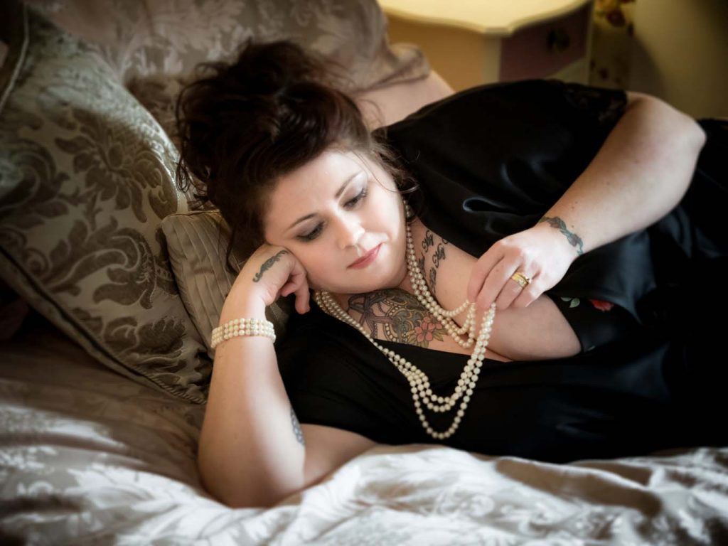 plus size womans Boudoir photoshoot wearing pearls