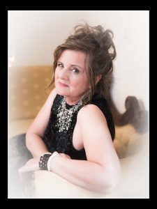 lady in black dress talking about her boudoir journey