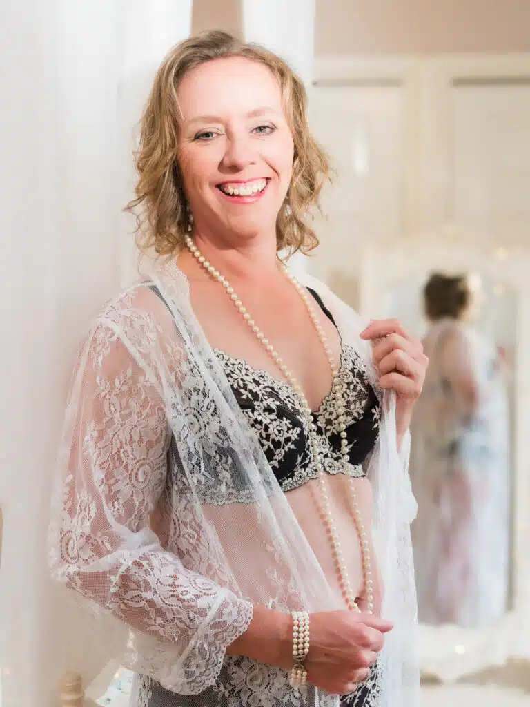 woman in white lacy lingerie with reflection in mirror