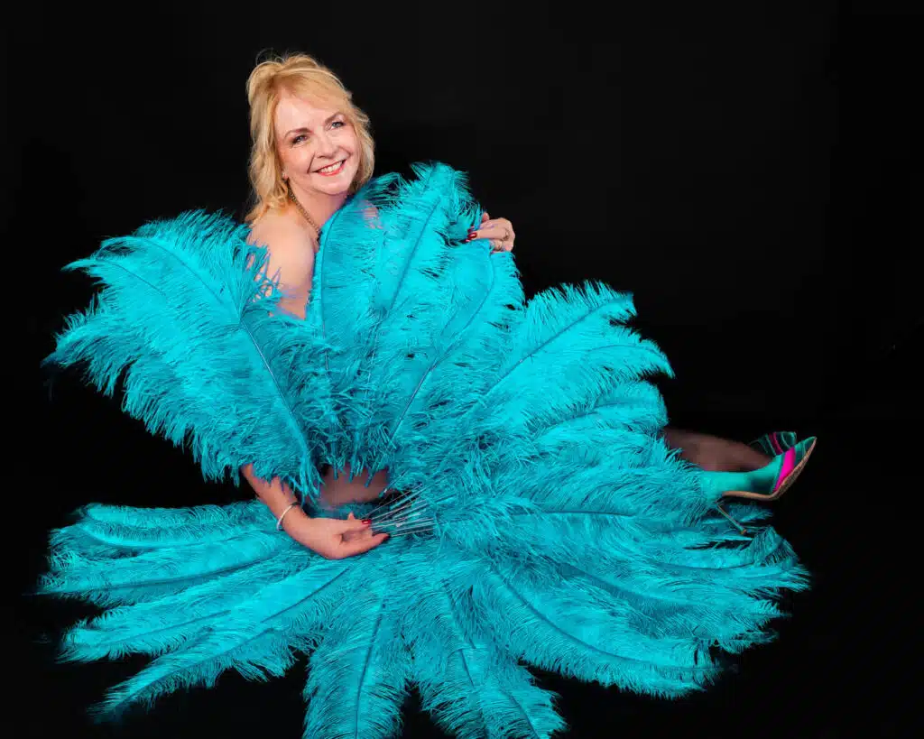 Symply Boudoir mature woman elegant with vibrant feather fans