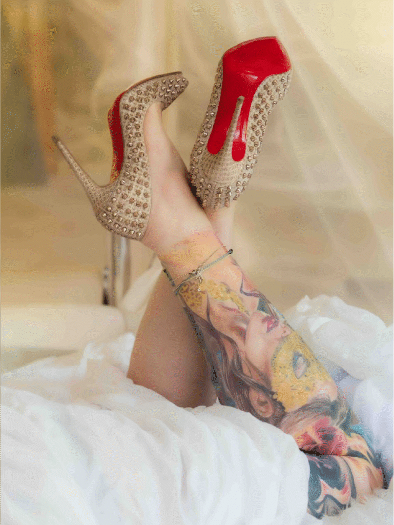 Mature lady's legs during boudoir photoshoot