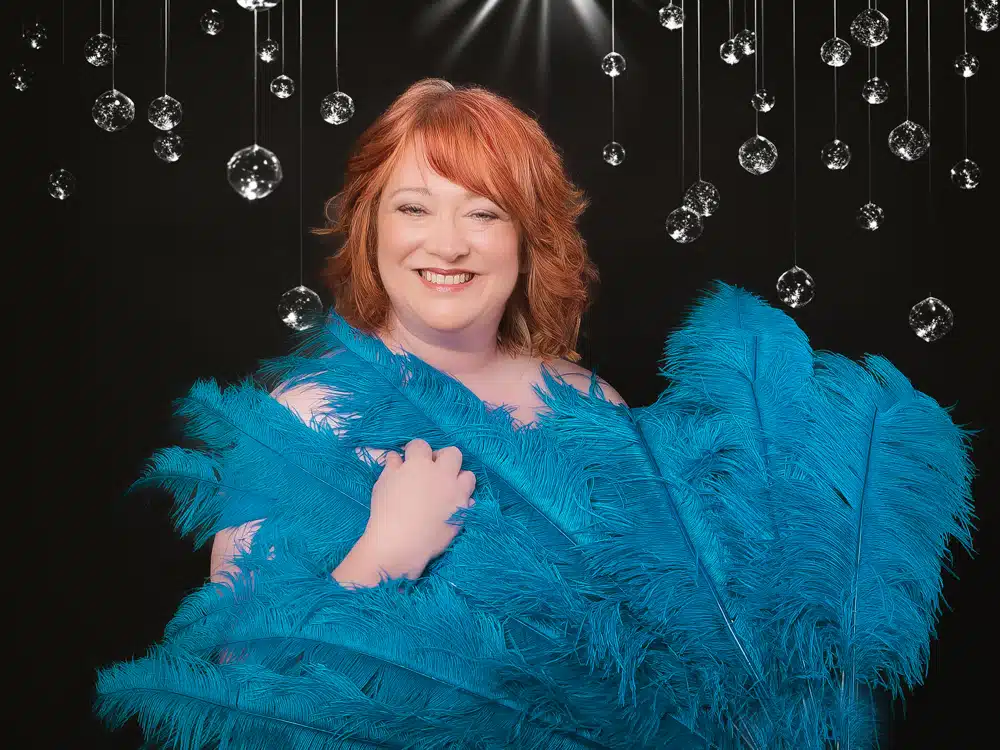 woman with blue burlesque feather fans