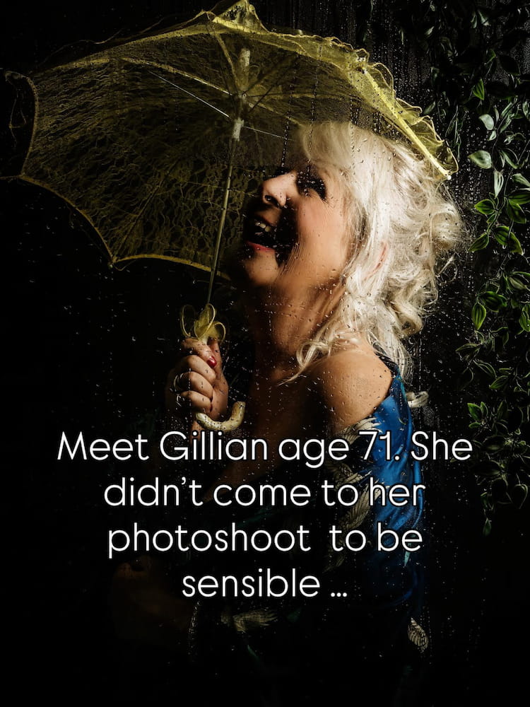 close up image of woman in shower setting for boudoir shoot holding yellow umbrella